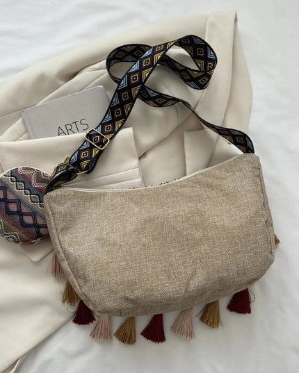 Bolso bandolera con detalle de borlas estampado y monedero pequeño