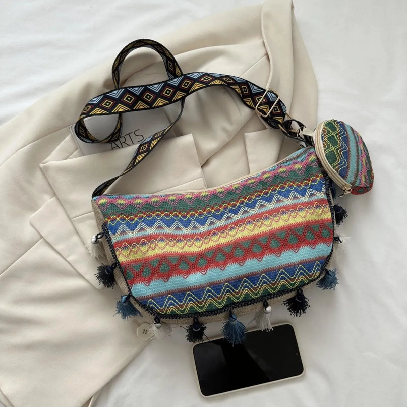 Bolso bandolera con detalle de borlas estampado y monedero pequeño