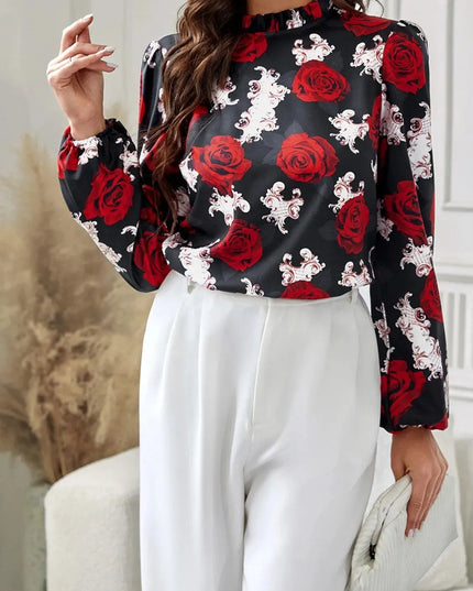 Blusa de cuello alto con mangas largas y estampado floral con volantes