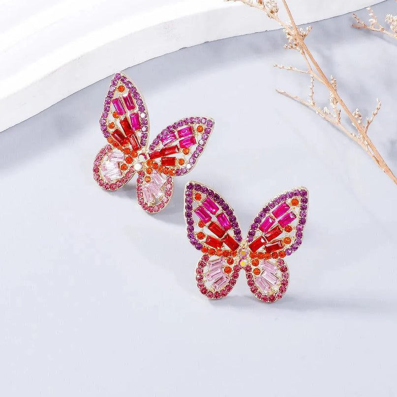 Pendientes de mariposa con diamantes de imitación incrustados en aleación