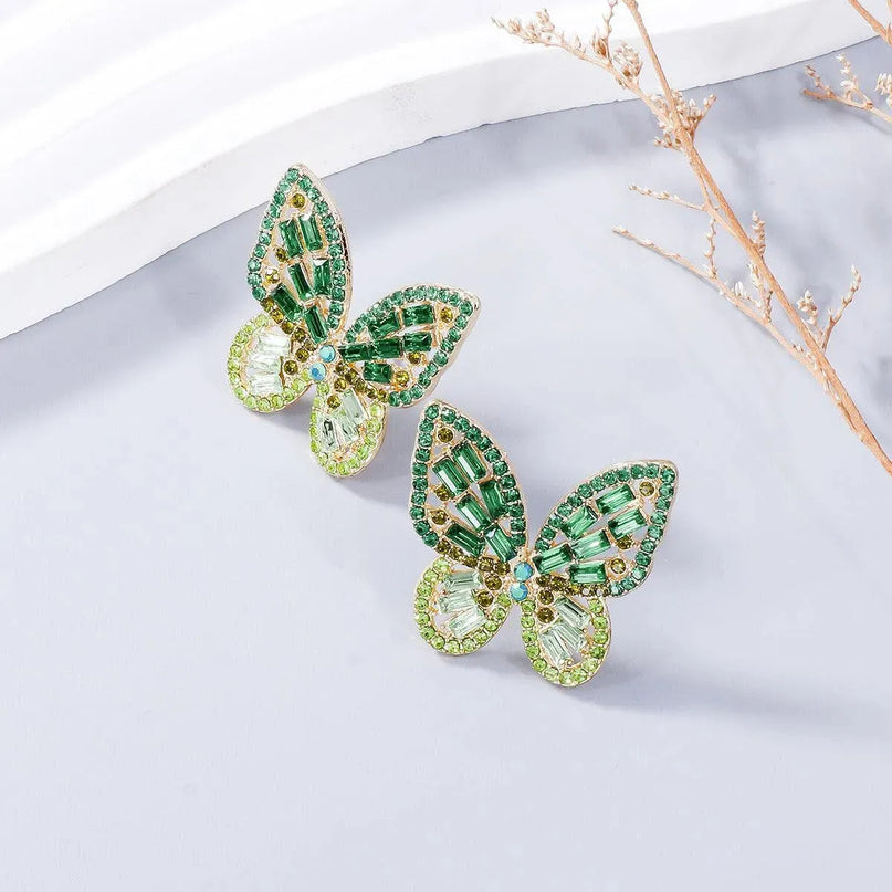 Pendientes de mariposa con diamantes de imitación incrustados en aleación