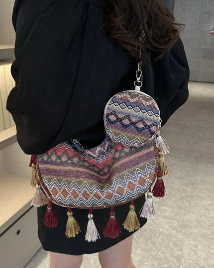 Bolso bandolera con detalle de borlas estampado y monedero pequeño