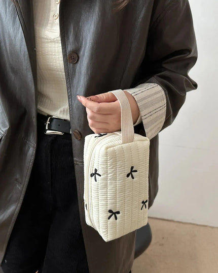 Minibolso de mano con detalle de lazo texturizado