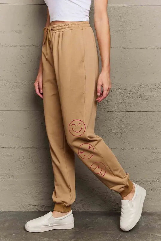 Pantalones deportivos largos informales con estampado de emojis