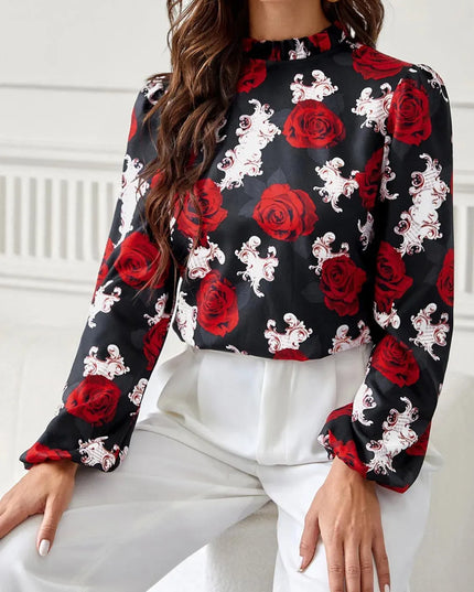 Blusa de cuello alto con mangas largas y estampado floral con volantes