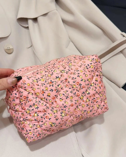 Cartera de mano acolchada con diseño floral y interior a cuadros