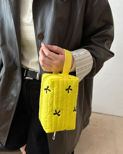 Minibolso de mano con detalle de lazo texturizado