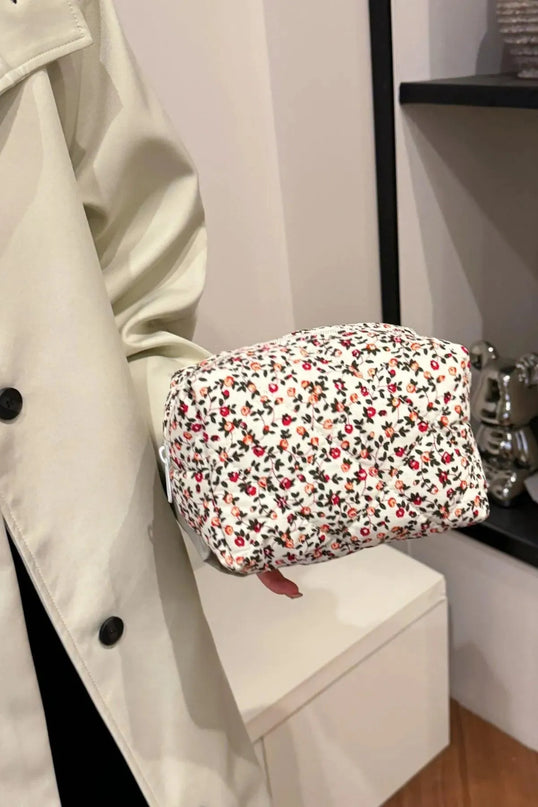 Cartera de mano acolchada con diseño floral y interior a cuadros