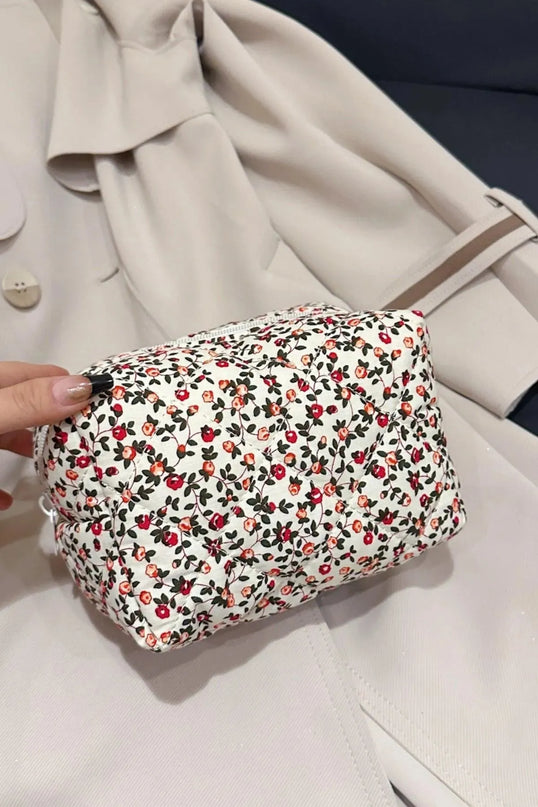 Cartera de mano acolchada con diseño floral y interior a cuadros