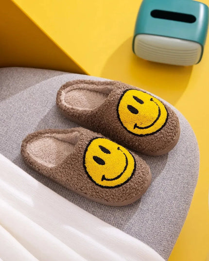 Pantuflas de peluche con cara sonriente y alegre